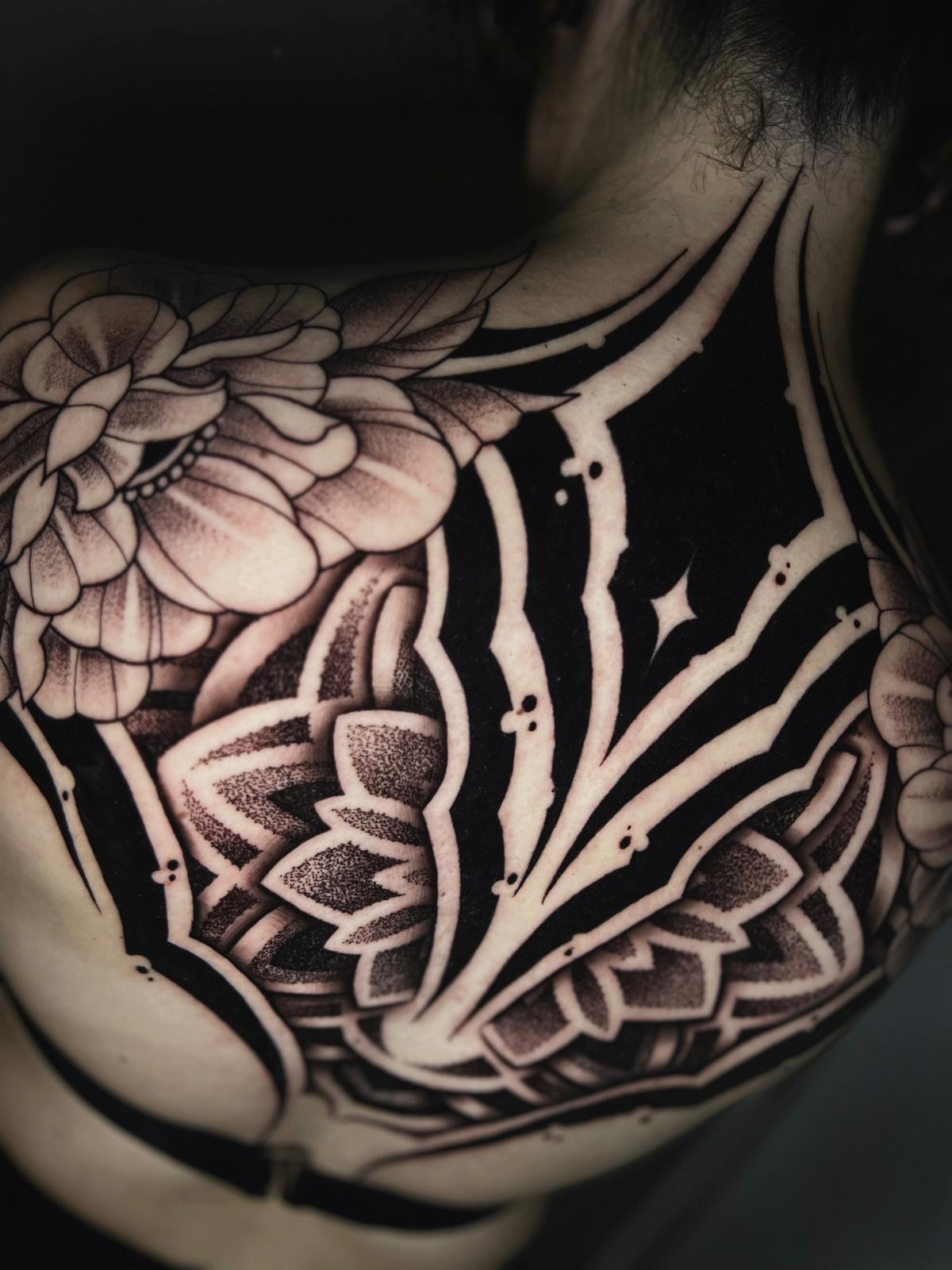 Tattoo artist working